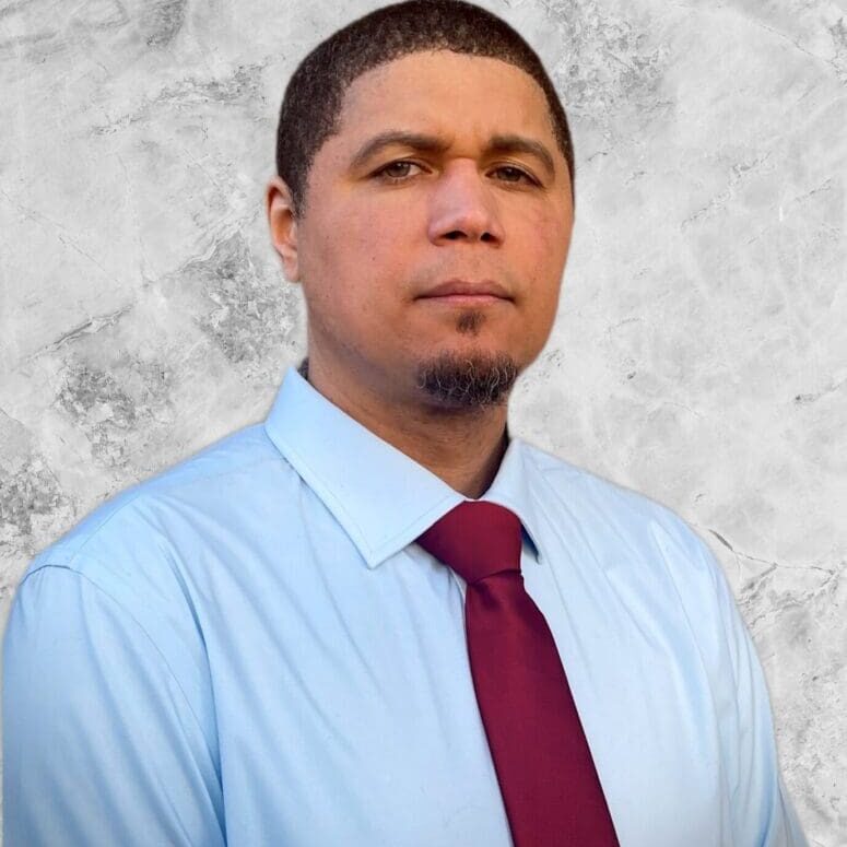 Mr. Rhome A man in a blue shirt and red tie.